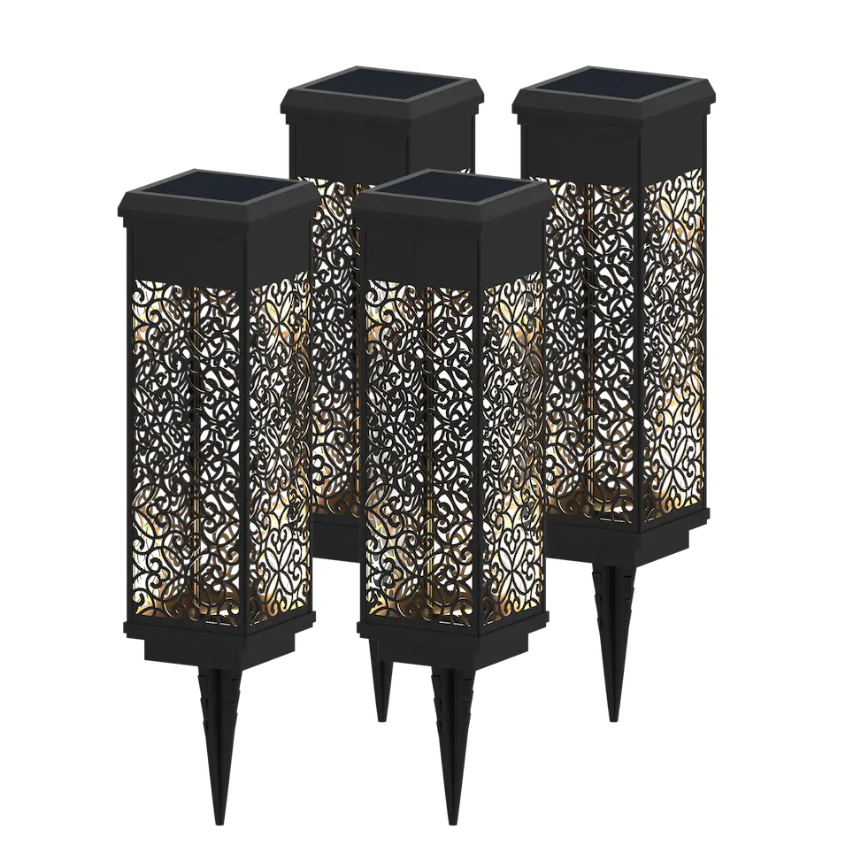 Four black solar-powered garden lights with decorative patterns on a white background